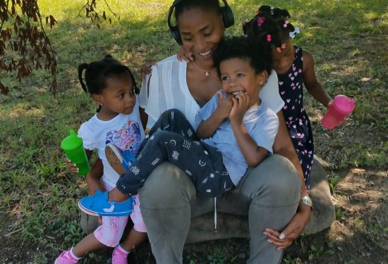 Danielle Caldwell and her home-based child care program enjoying the outdoors.