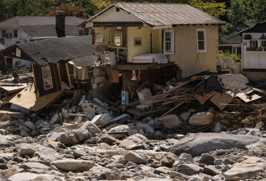 Homes are seen in the aftermath of Hurricane Helene, Wednesday, Oct. 2, 2024, in Chimney Rock Village, N.C. (AP Photo/Mike Stewart)