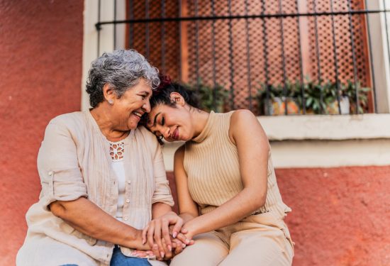 Grandmother and granddaughter together outdoors